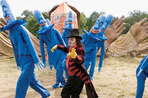A SPLENDID TIME: The ringmaster Mr. Kite (Eddie Izzard) performs with his circus in Julie Taymor's Across the Universe